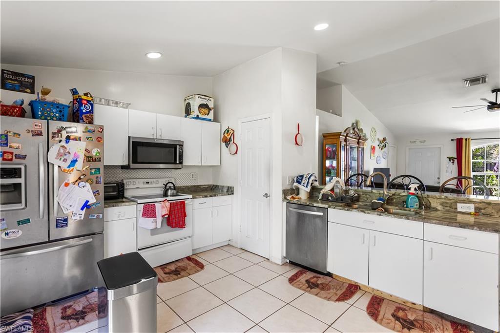 NEWER STAINLESS-STEEL APPLIANCESincluding a large refrigerator/freezer,microwave, and dishwasher