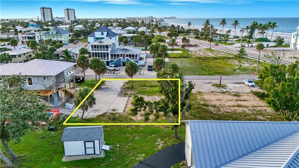 View of property location featuring property parcel outlined and a nearby body of water - Virtually Edited Image