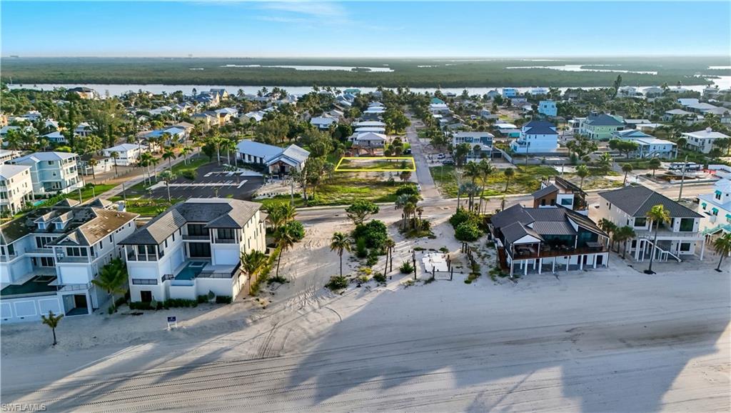 Aerial view of residential area featuring a large body of water - Virtually Edited Image