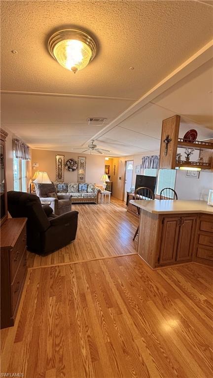 Open concept living area featuring wood-look flooring throughout