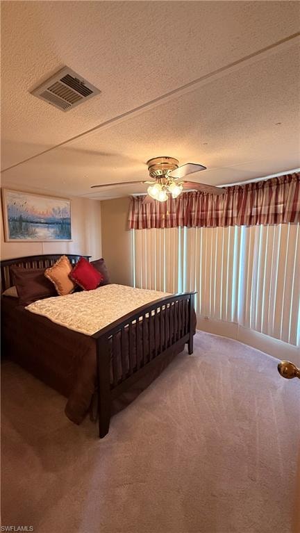 Guest Bedroom featuring neutral carpet flooring, vaulted ceiling, and a ceiling fan with integrated lighting