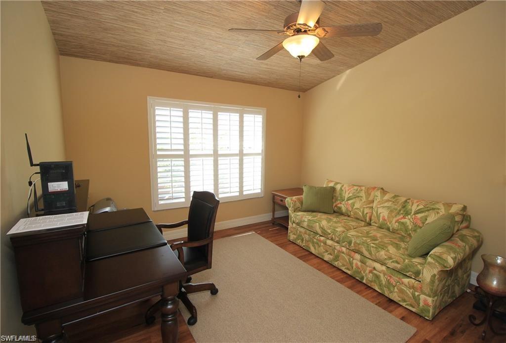 Office area with ceiling fan, hardwood / wood-style floors, and wooden ceiling