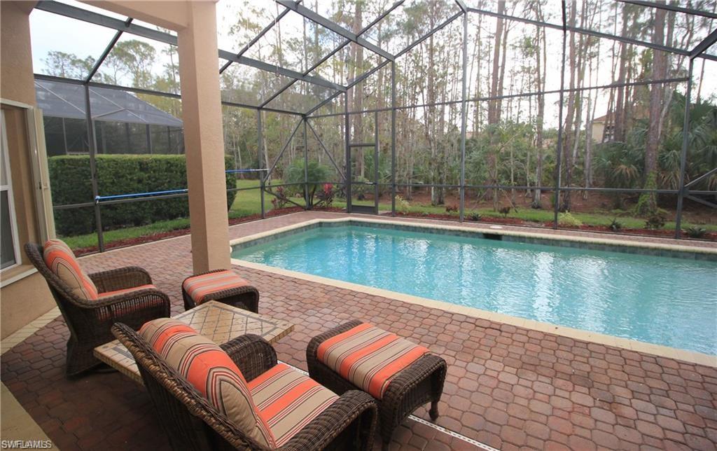 View of pool featuring a lanai and a patio area