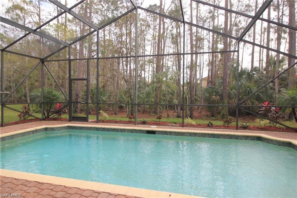 View of pool with a lanai