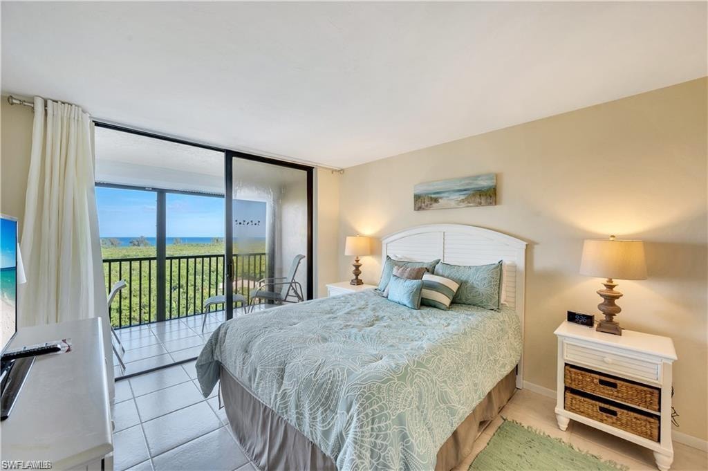 Bedroom featuring access to outside and tile patterned floors