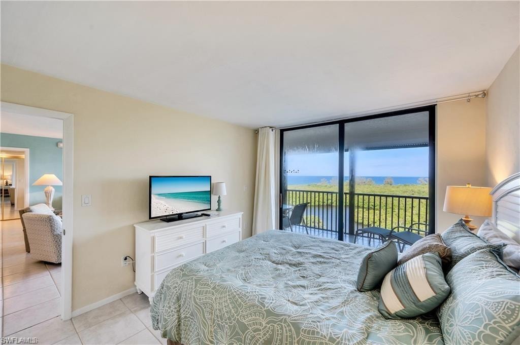 Tiled bedroom with access to exterior