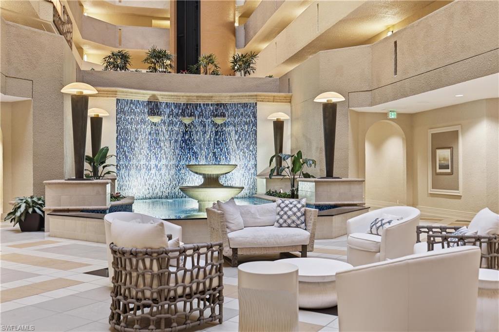 Multi-level atrium featuring a two-tiered water fountain with a blue mosaic tile wall