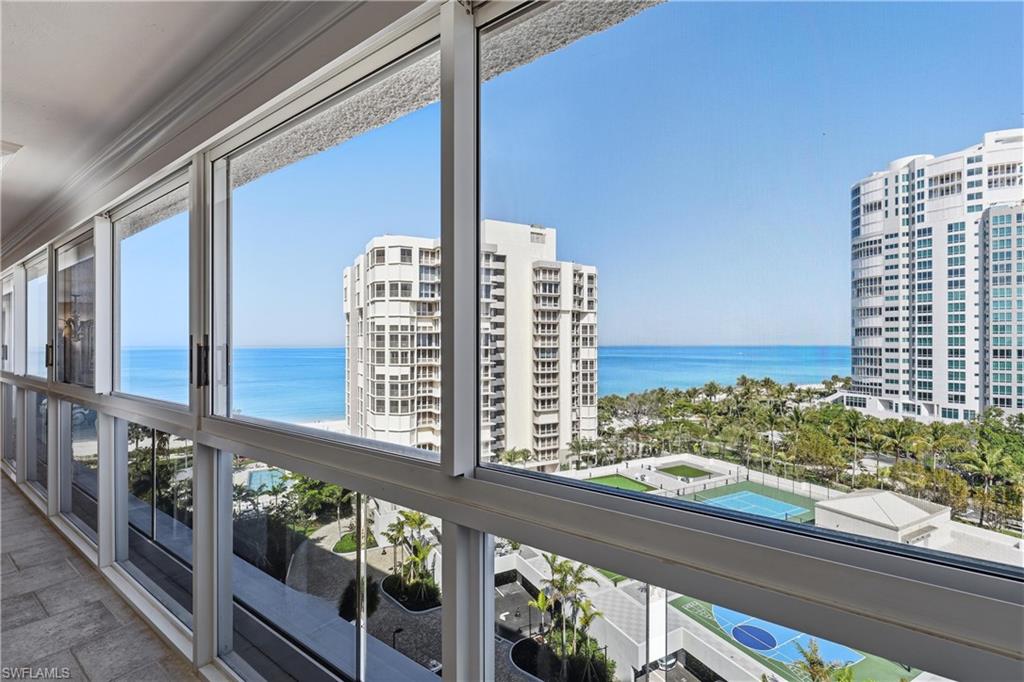 Expansive window wall overlooking the ocean and surrounding properties