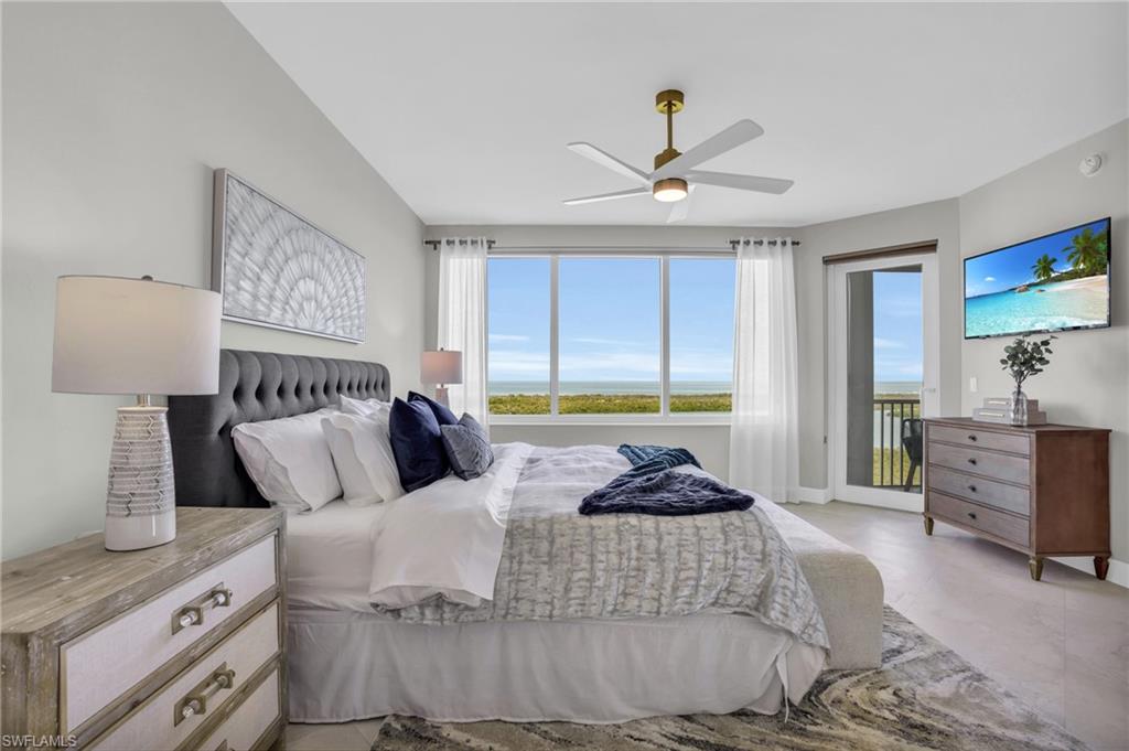 Bedroom with access to outside and ceiling fan