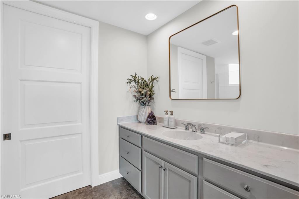 Bathroom featuring vanity and tile patterned floors