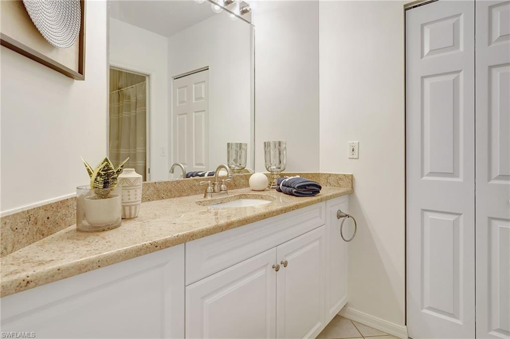 Bathroom with vanity and tile patterned flooring