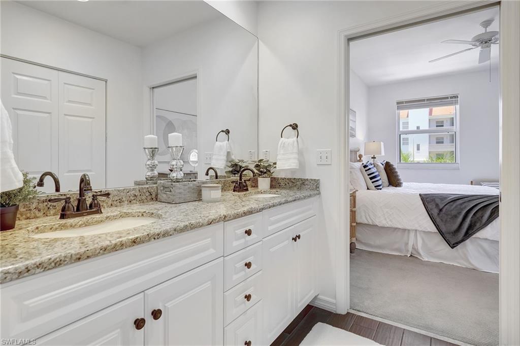 Bathroom with dual vanity and ceiling fan