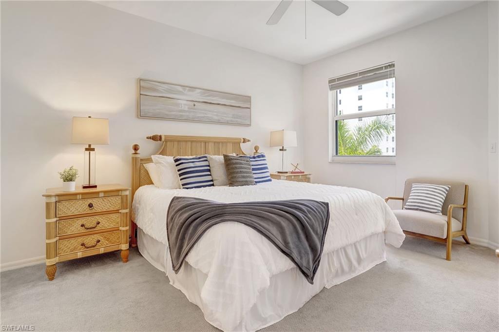 Carpeted bedroom with ceiling fan