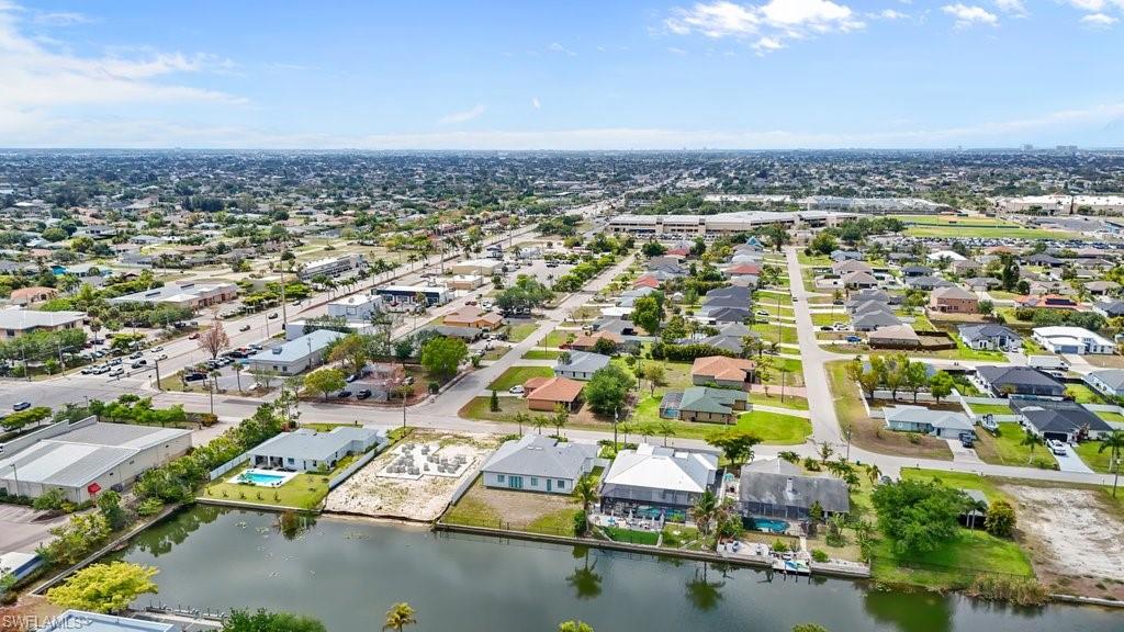 Aerial perspective showcasing a residential area with canal-front properties