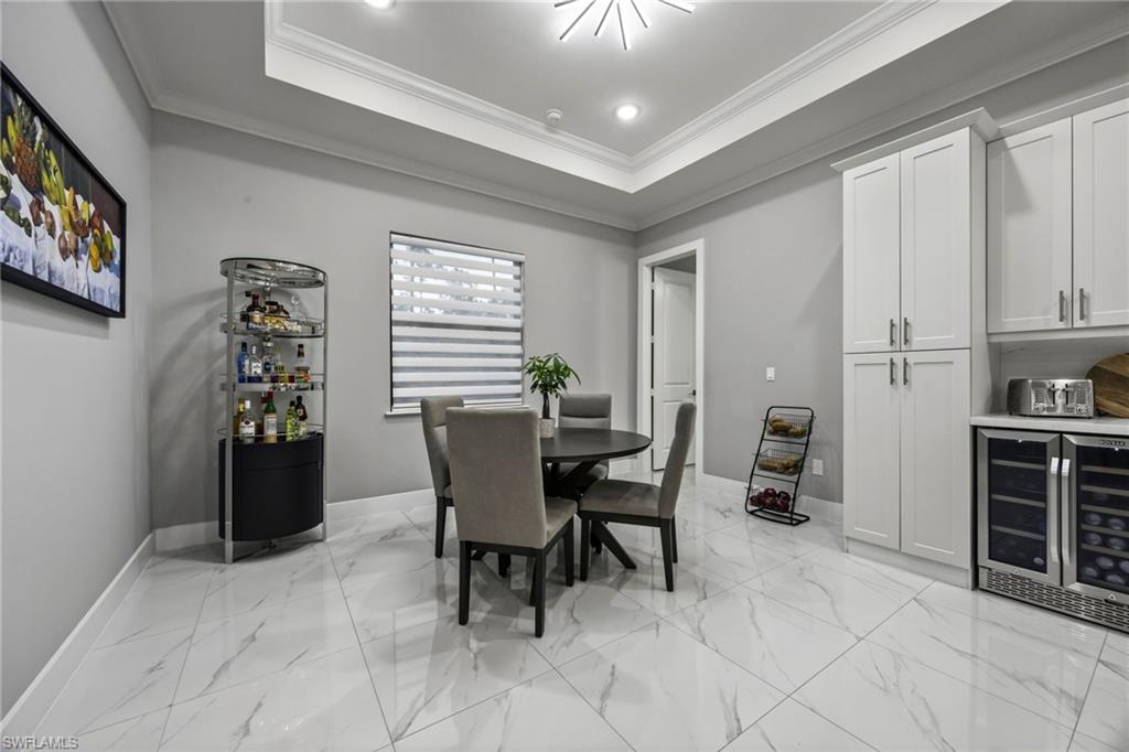 Dining area featuring crown molding, and recessed lighting