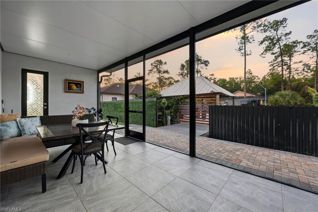 Screened patio featuring large format tile flooring