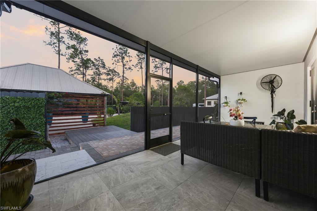 Screened patio featuring large format tile flooring