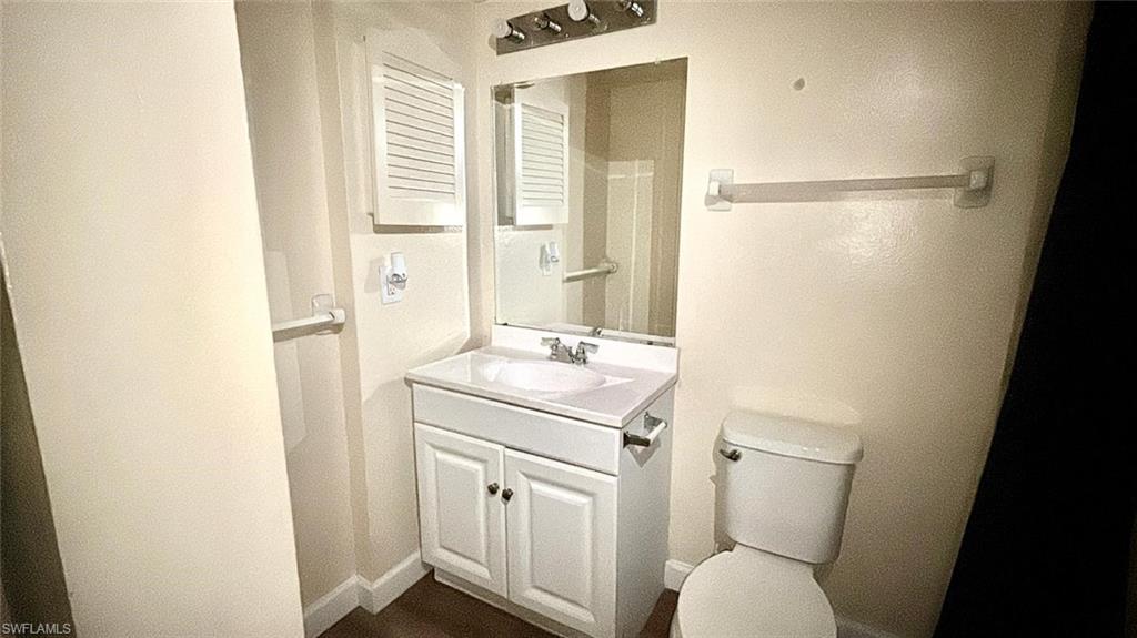 Bathroom with vanity and toilet