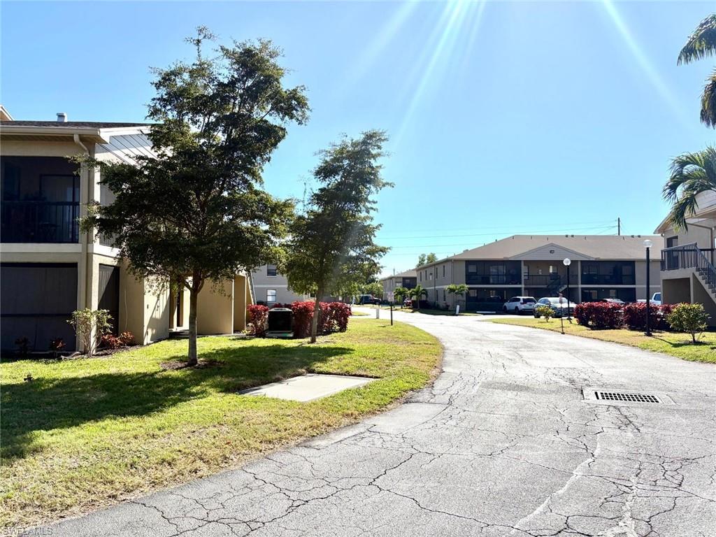 View of asphalt street with a residential view