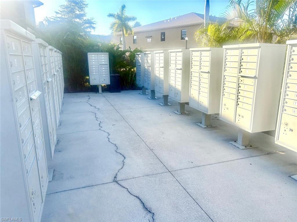View of home's community with mail area and a patio area
