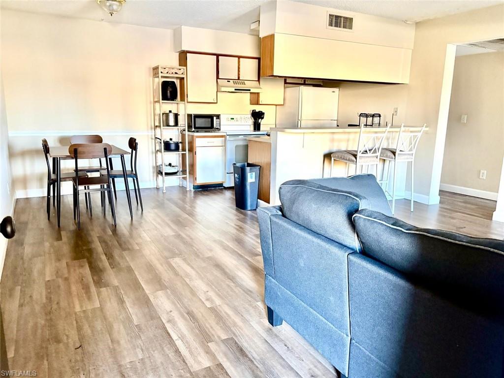 Living area featuring light wood-style flooring