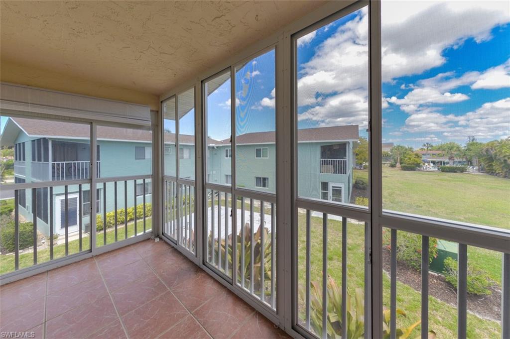 View from Covered and screened Lanai. Features large tile flooring and sliding windows for year round enjoyment.