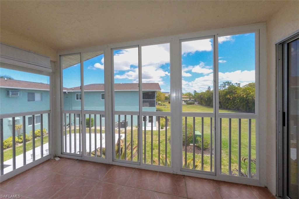 View from Covered and screened Lanai. Features large tile flooring and sliding windows for year round enjoyment.