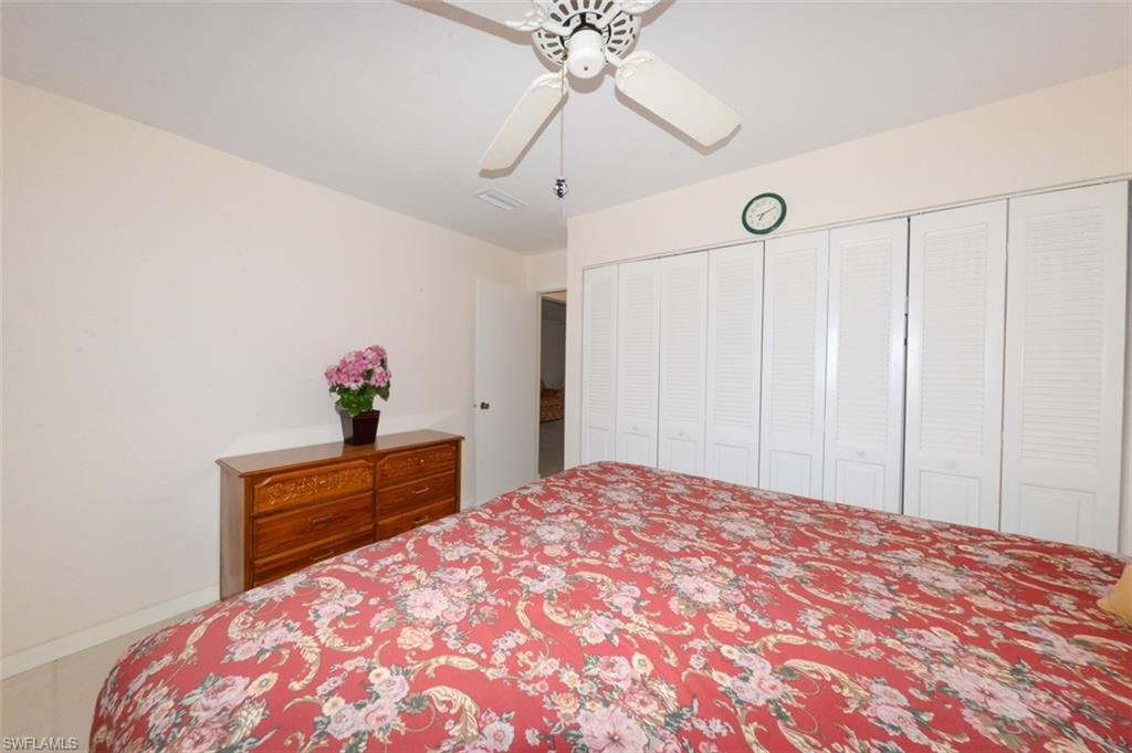 Guest bedroom looking toward hall and leading to guest bathroom.