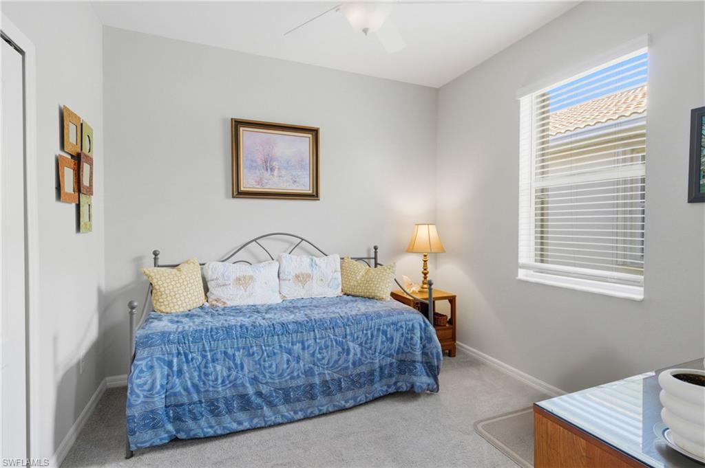 Clean and inviting guest bedroom featuring a simple layout and a calm, comfortable atmosphere.