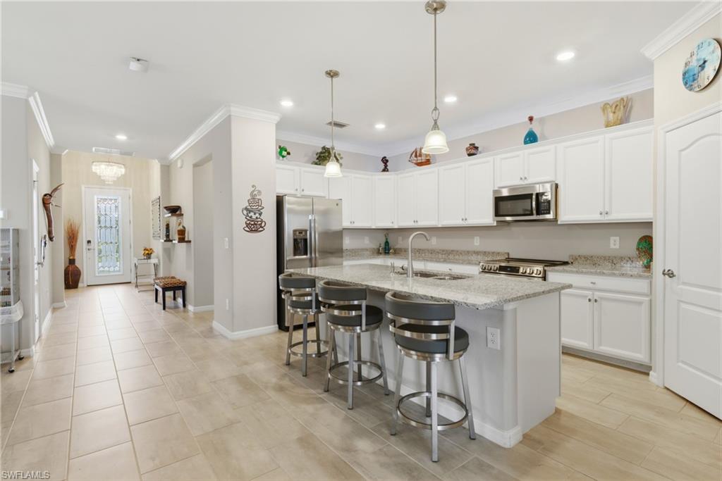 Modern kitchen with sleek finishes, abundant cabinetry, and high-end appliances designed for effortless cooking and entertaining.
