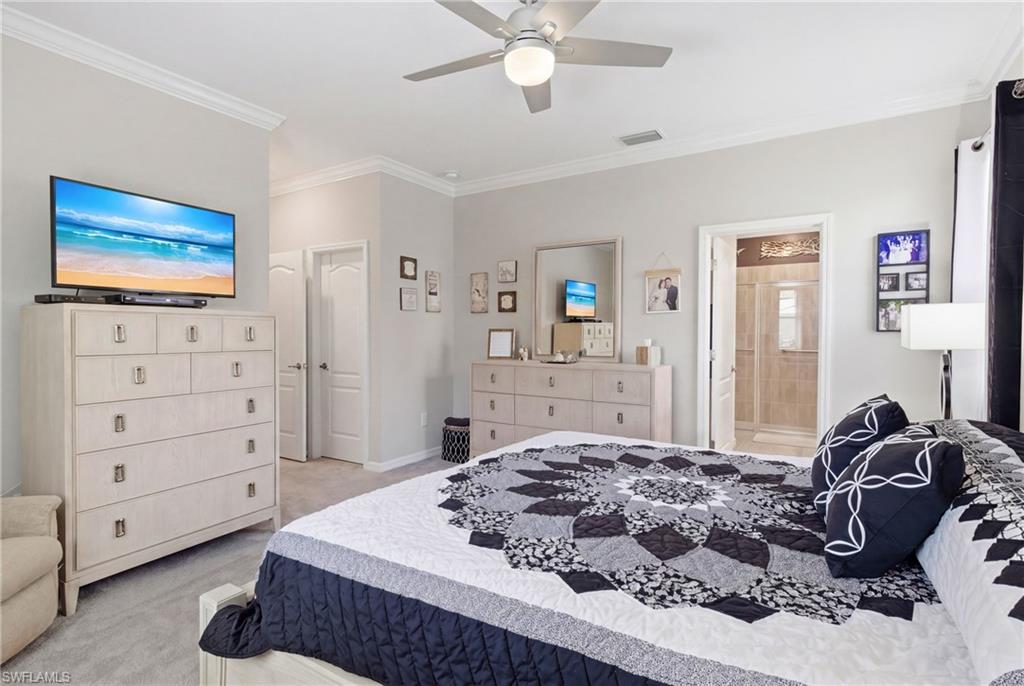 Spacious primary suite offering a private retreat with elegant finishes and oversized walk-in closets.