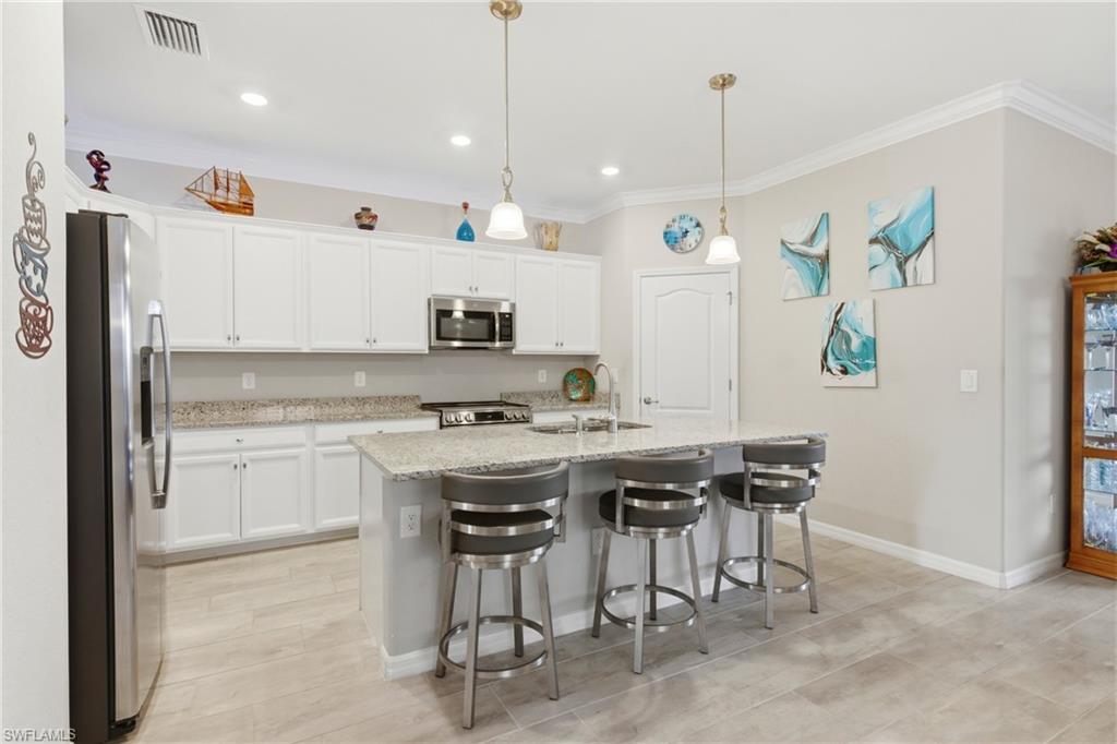 Well-designed kitchen offering a clean, open feel with upgraded features and seamless connection to the living areas.