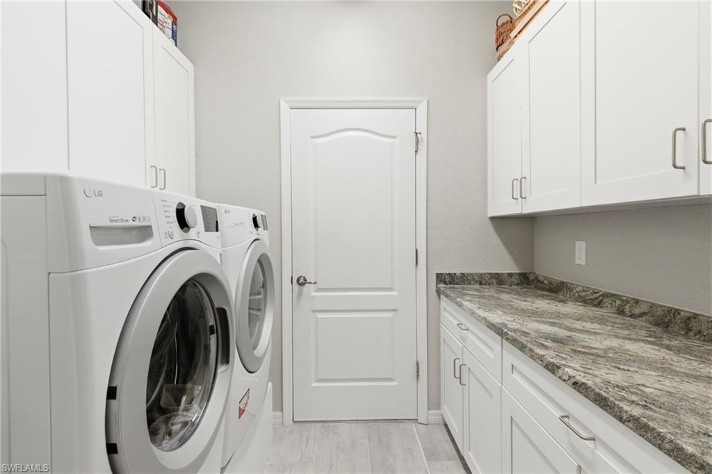 Oversized laundry room with added storage and workspace for everyday convenience.