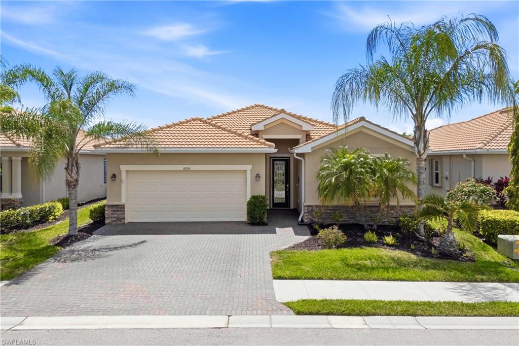 Elegant front elevation offering a bright, inviting look with a warm Florida feel.