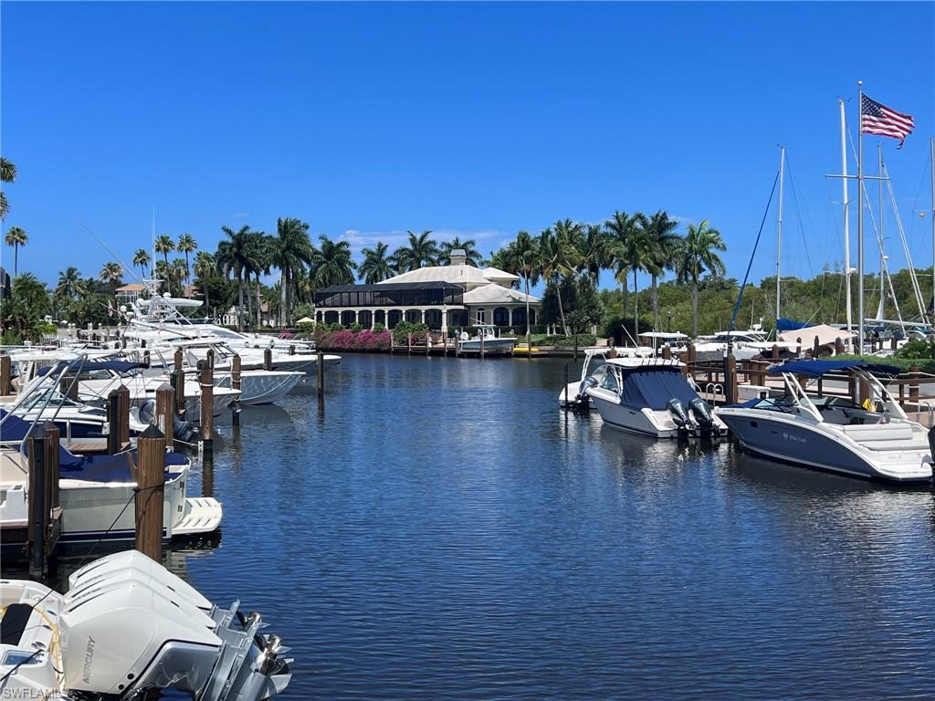 Waterfront canal featuring multiple docked boats