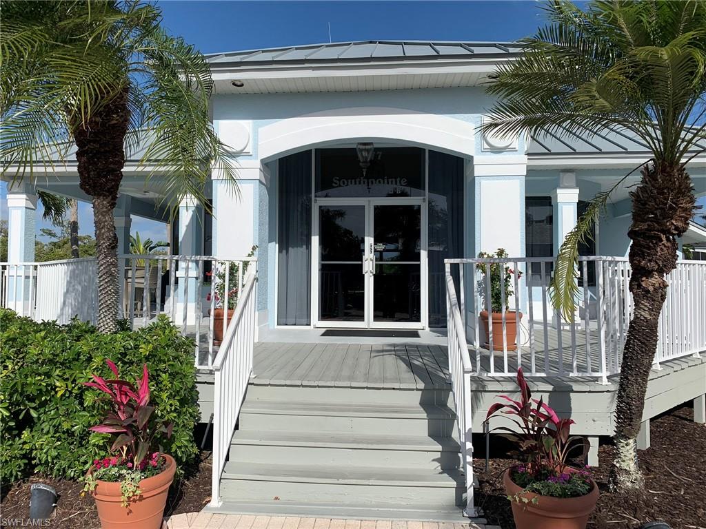 Light blue and white exterior with a covered entry