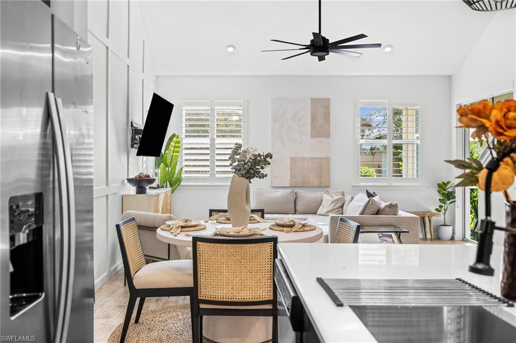 Open-concept living space with vaulted ceilings and wood-finish flooring