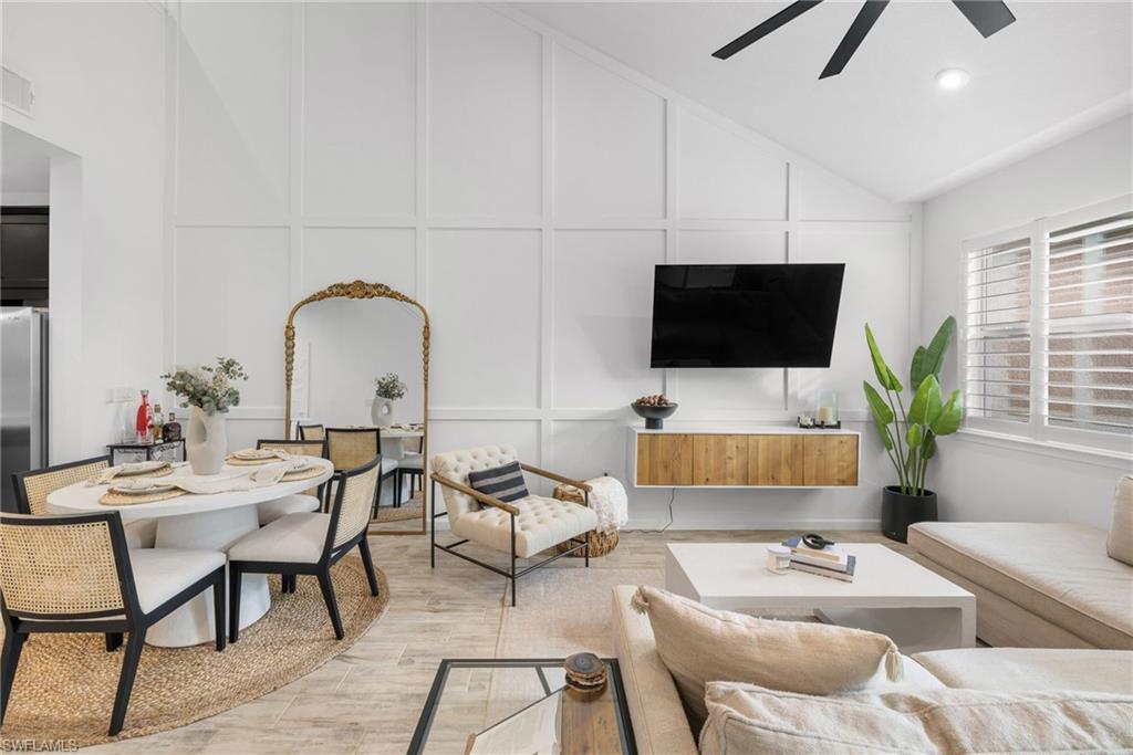 Vaulted ceiling with a contemporary ceiling fan and recessed lighting