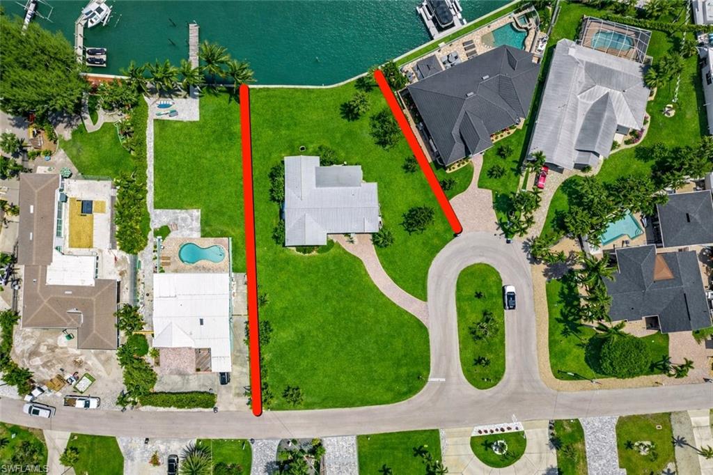 Approximate property boundaries in red showing large side yard