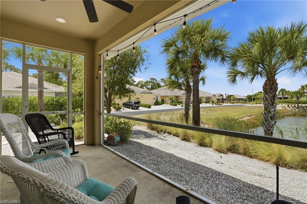 Screened lanai featuring a ceiling fan, recessed lighting, string lights, and concrete flooring