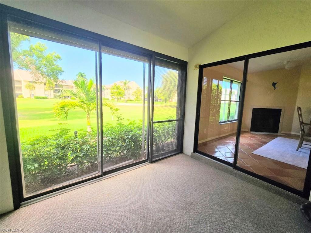 Glass Enclosed Lanai w/Sliders to Yard & Den