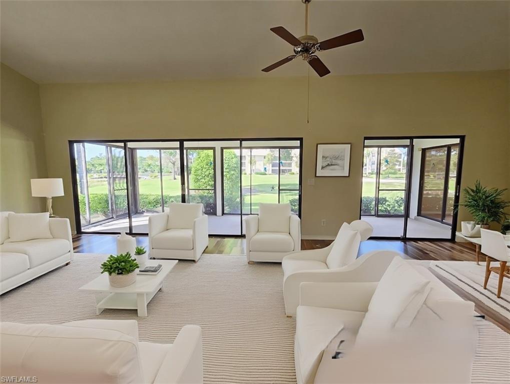 VIRTUALLY STAGED Great Room w/White Modern Furniture & Brazilian Pecan Flooring facing Lanai & Golf Course - View 2