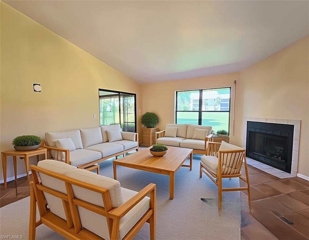 VIRTUALLY STAGED Den w/Scandinavian Furniture w/Fireplace & Sliders facing Lanai & Golf Course