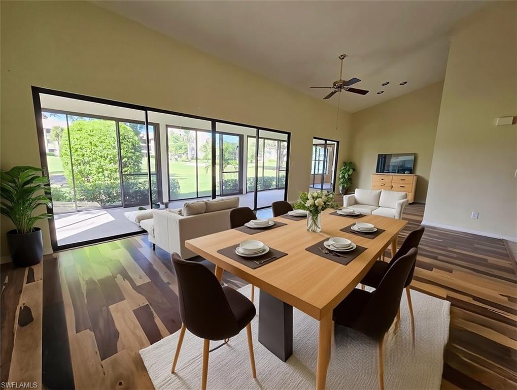 VIRTUALLY STAGED Great Room/Dining Area w/Scandinavian Furniture & Brazilian Pecan Flooring facing Lanai & Golf Course - View 3