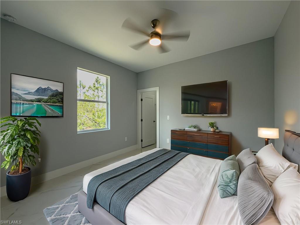 3rd Bedroom featuring baseboards, ceiling fan, and marble finish floor