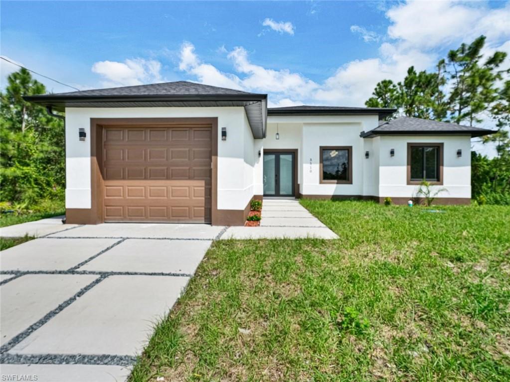Contemporary architecture featuring a white stucco exterior with brown accents
