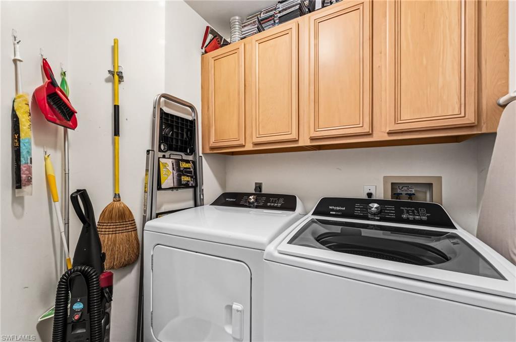 Laundry room offers extra storage.