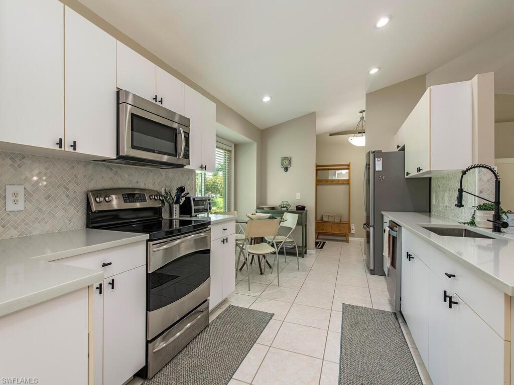 Kitchen with quartz countertops, SS appliances