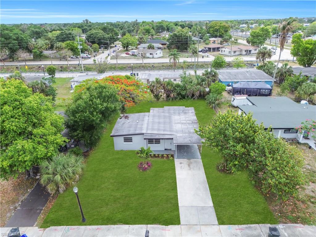 View of home with long driveway