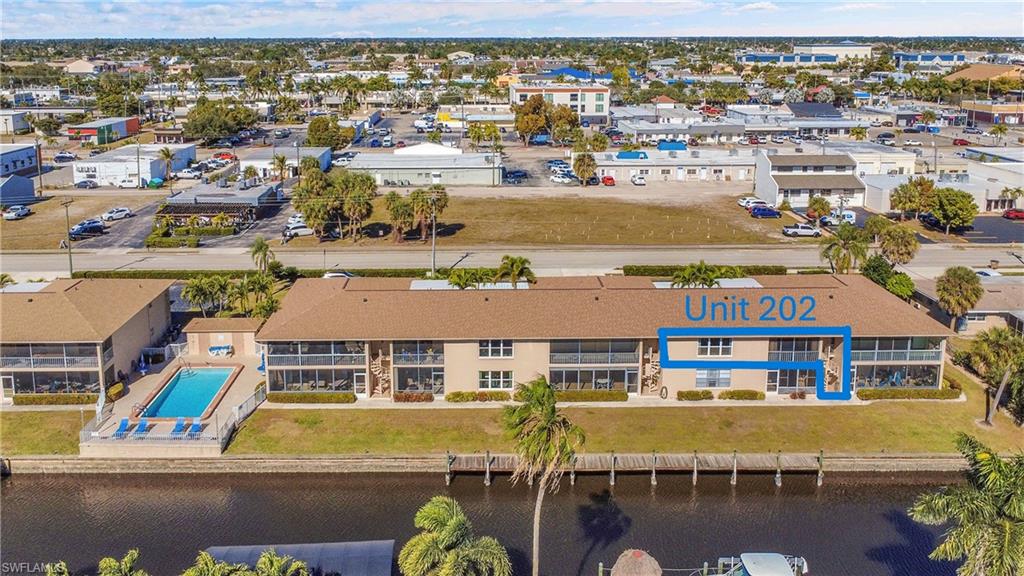 Unit 202 has access to pool and boat dock via spiral staircase located at lanai back door. Cape Coral Pkwy is only 2 blocks north. Walkable to multiple restaurants and shops.